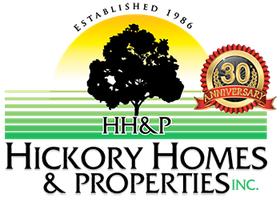 A logo for hickory homes and properties inc.