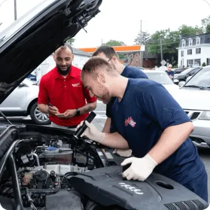 Mechanic Examining an Engine | Palumbo’s Automotive