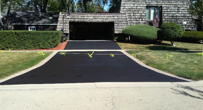 before picture of asphalt driveway