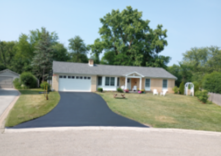 after picture of newly sealed asphalt driveway