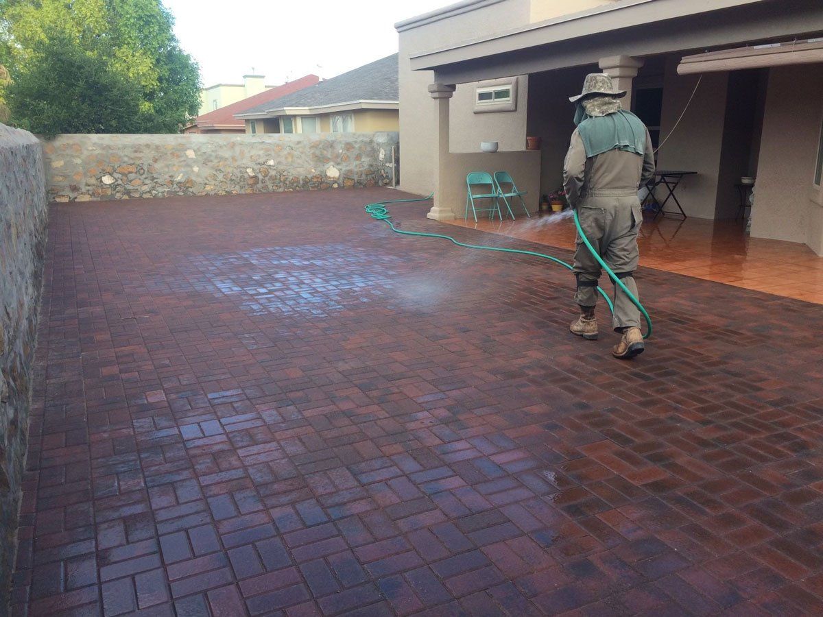 Man Cleaning the Brick Floor — El Paso, TX — Daniel's Tree & Landscaping, Inc.