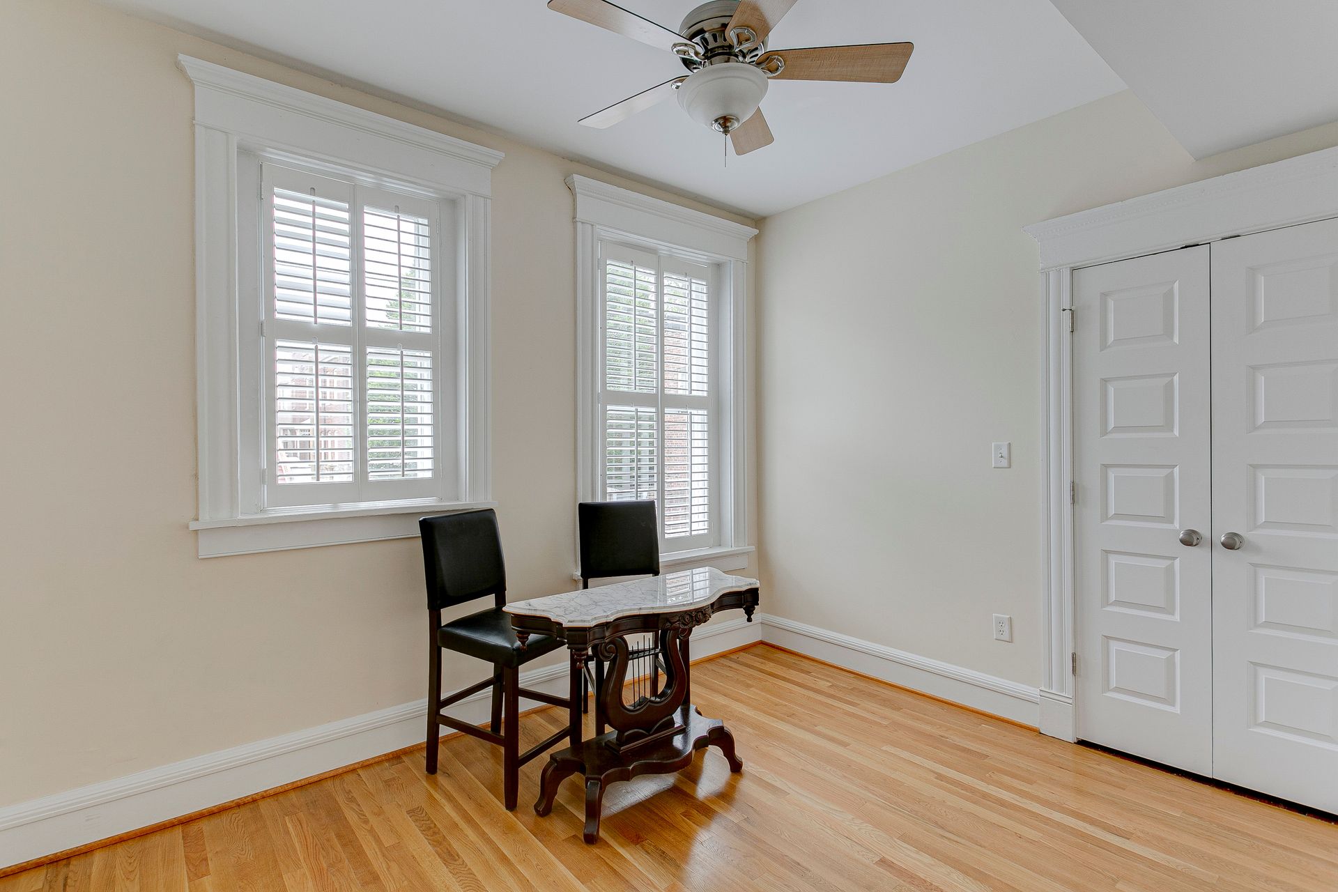 Interior office space, plantation shutters, empty room, hardwood floors. Interior office space, plantation shutters, empty room, hardwood floors.