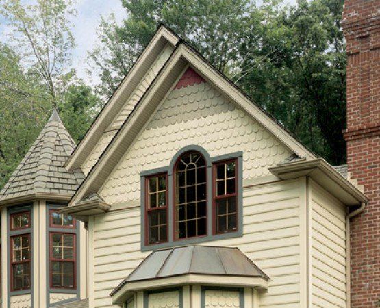 Yellow Paint House — Bentonville, AR — Northwest Arkansas Windows and Siding