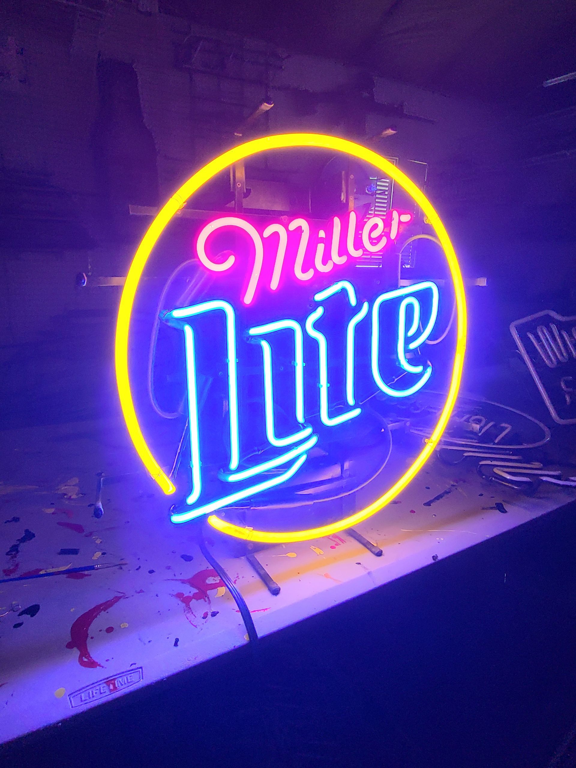 Neon Miller Lite sign, yellow circle, blue 