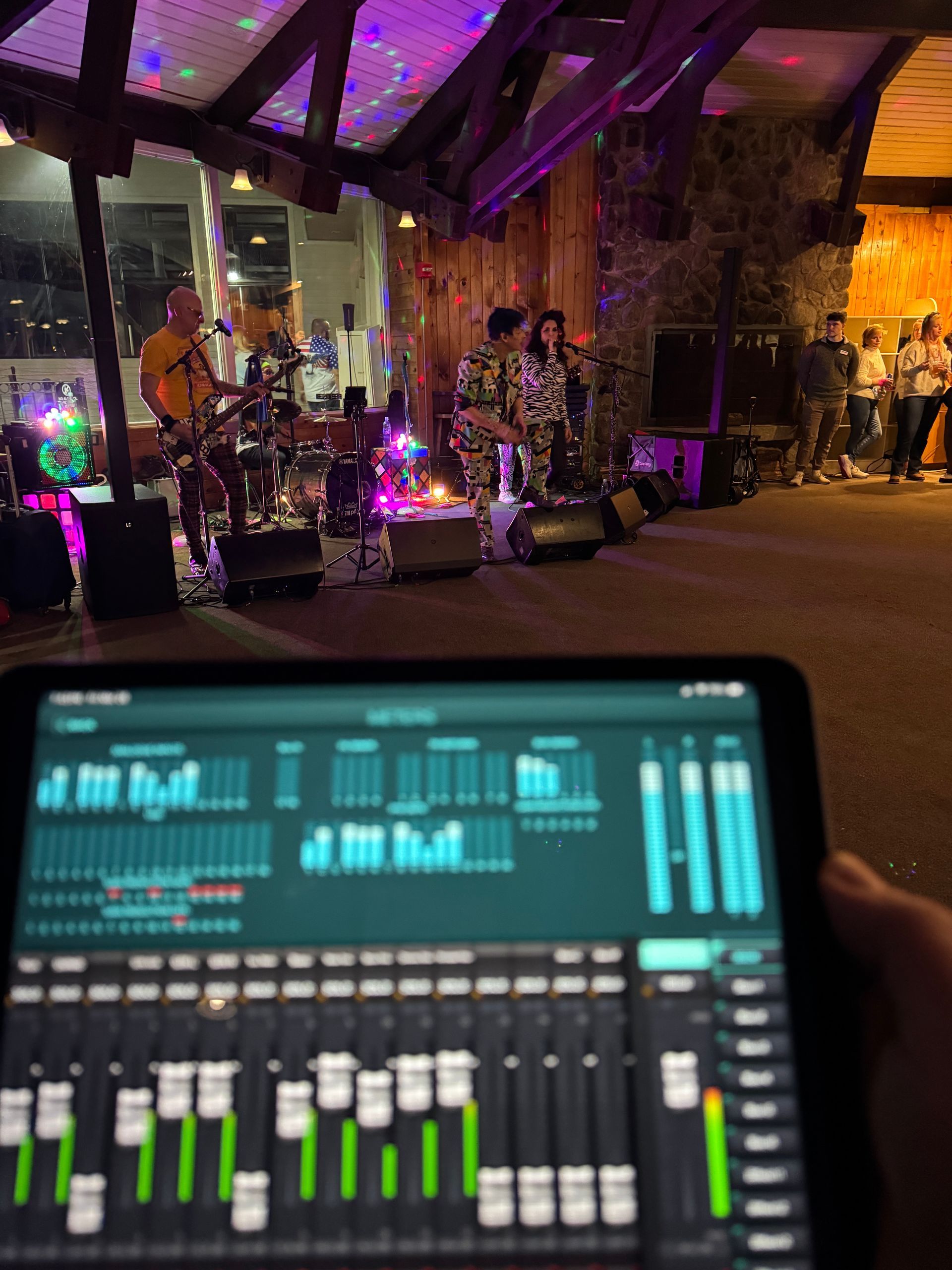 DJ turntable with a bright pink platter, lit colorful buttons.