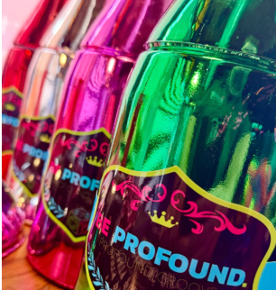 Colorful metallic bottles labeled 