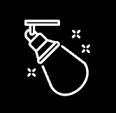 White outline of a spotlight hanging from a ceiling, with sparkles around the light beam.