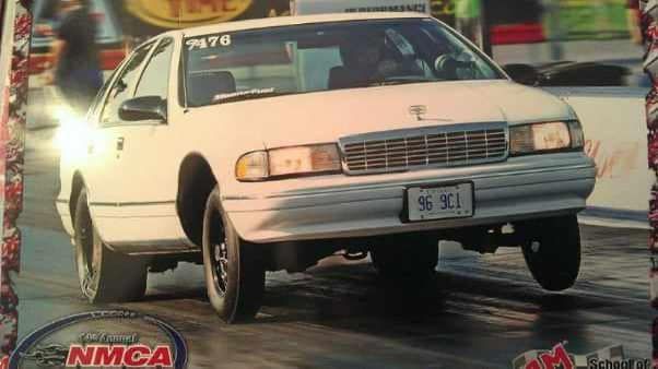 A white car with a license plate that says 96-901