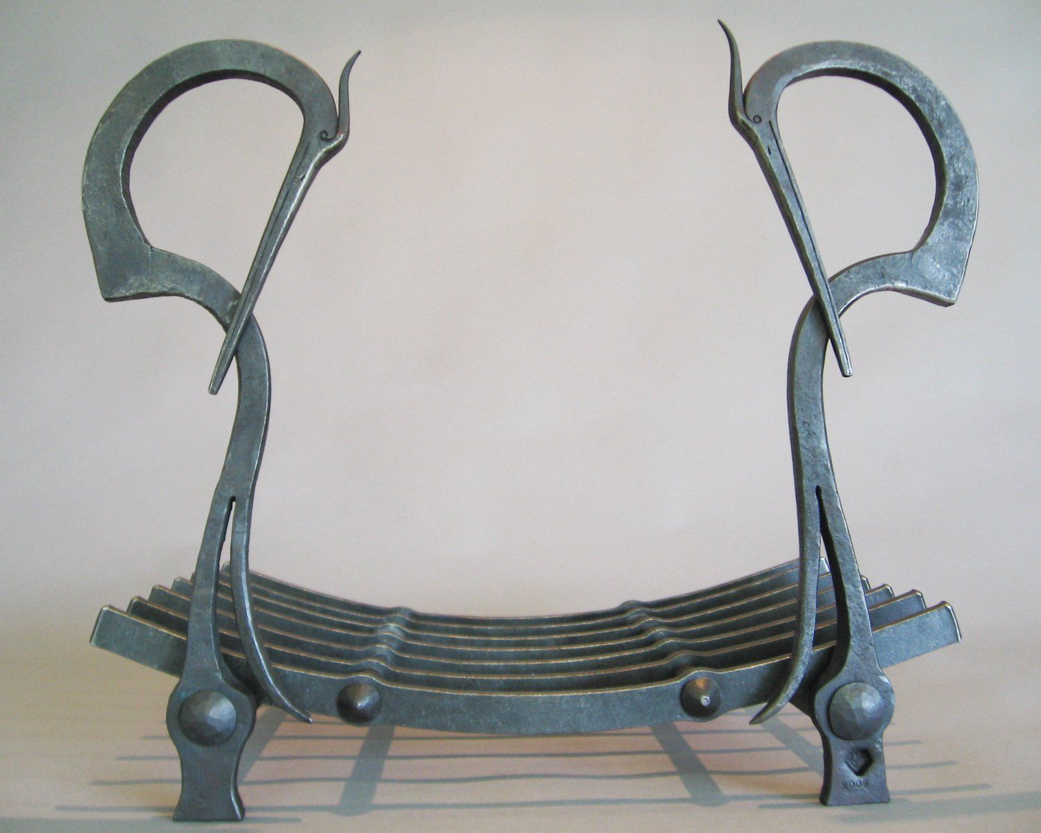 hand forged fireplace wood storage Herons