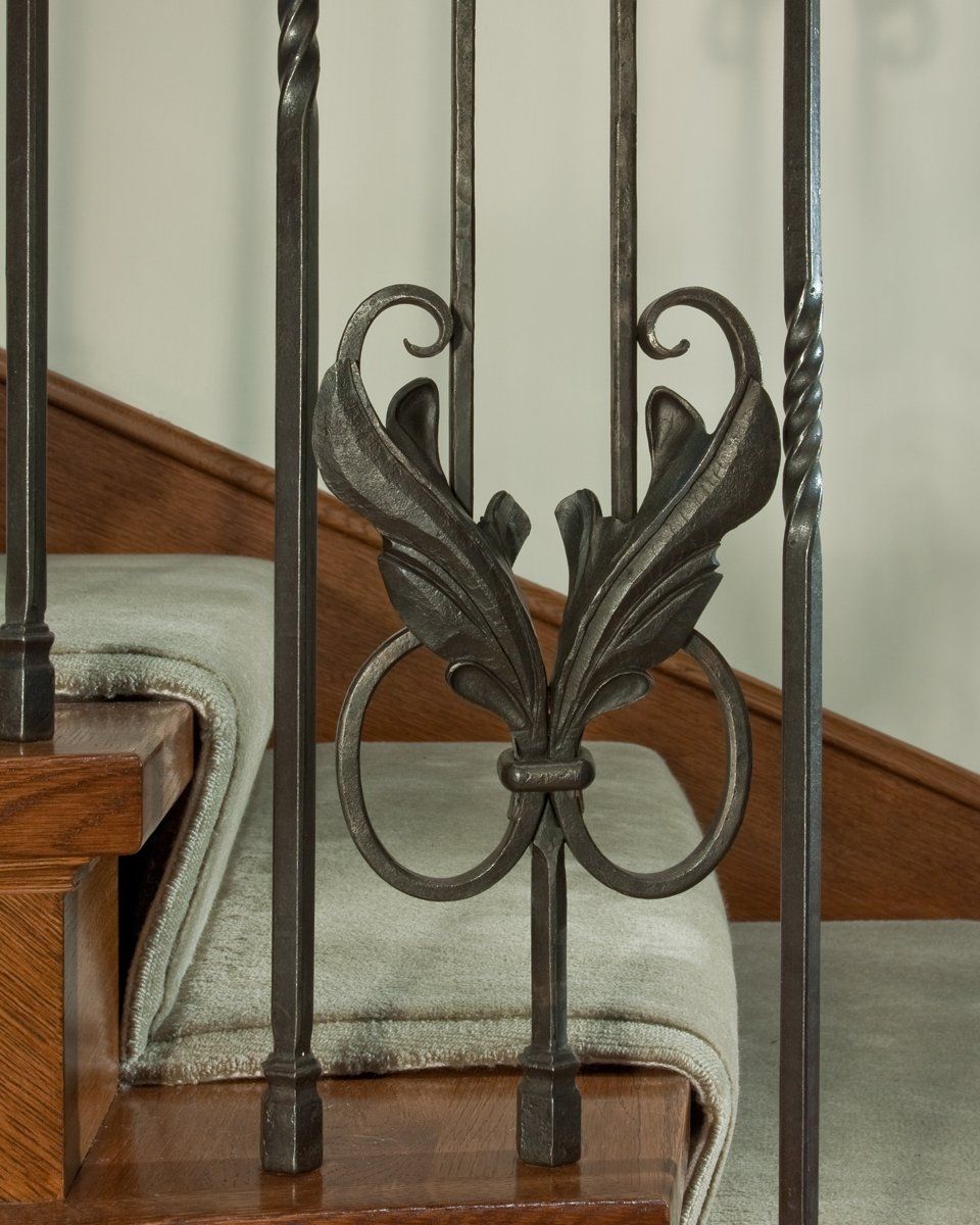 forged iron & wood stairwell banister detail