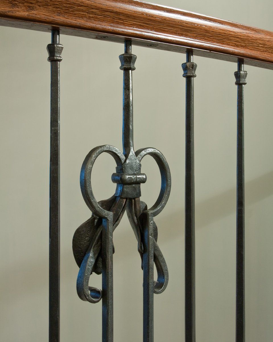 forged iron stairwell banister detail