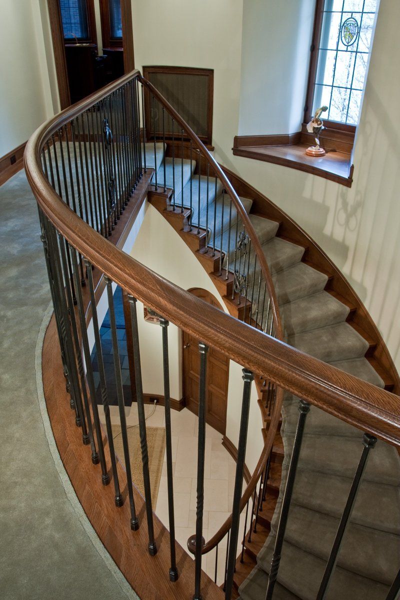 custom forged iron & wood curved stairwell banister
