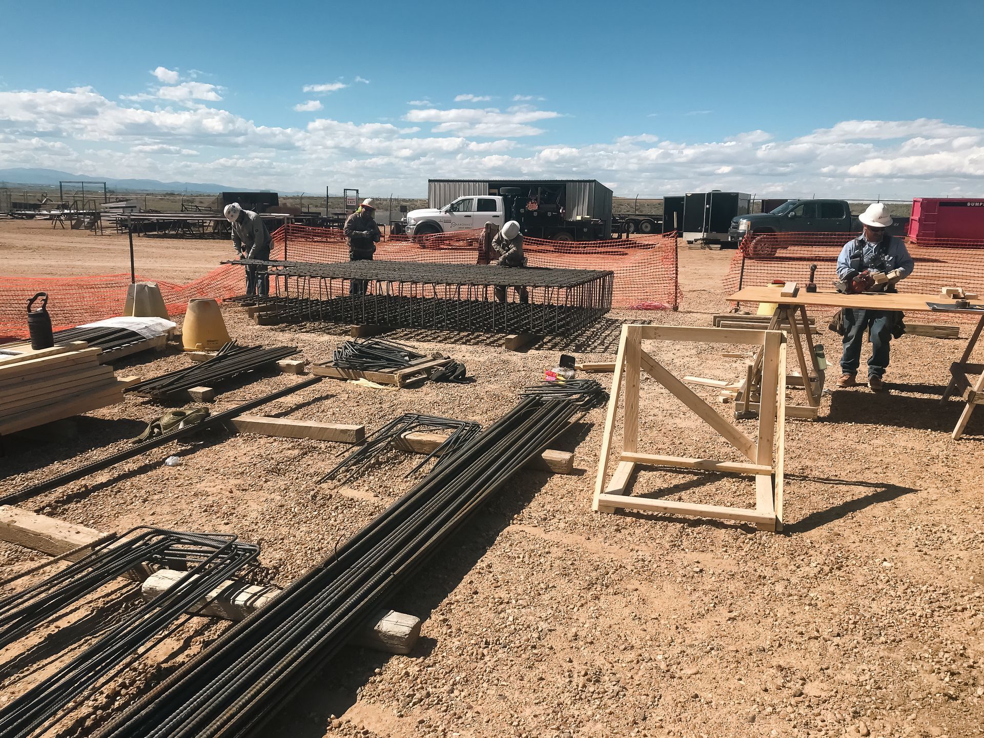 A group of construction workers are working on a construction site.