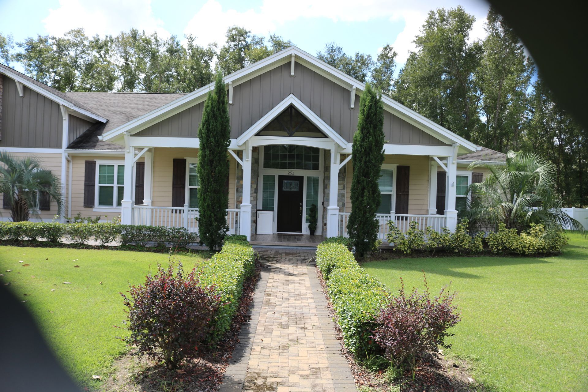Isometric drawing of a large mansion with towers, a swimming pool, and a circular driveway.