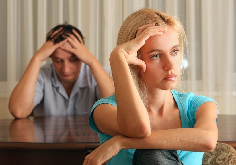 couple in argument looks frustrated with one another