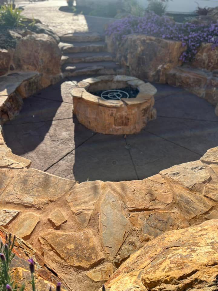 A Fire Pit Is Surrounded by Rocks and Steps | Redding, CA | Chase Design Landscape