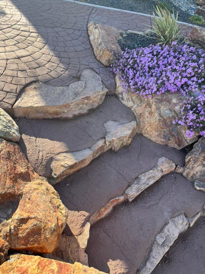 A Brick Walkway Surrounded by Rocks and Purple Flowers | Redding, CA | Chase Design Landscape