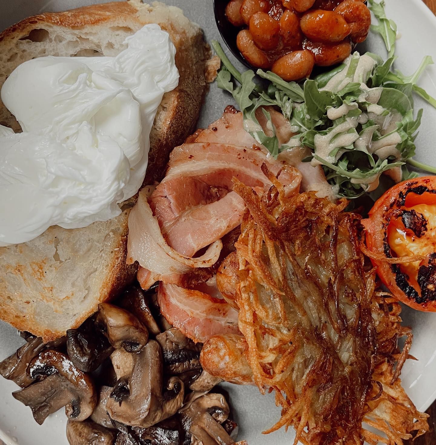 A Plate of Food With a Poached Egg on Top — The Pass Cafe in Byron Bay, NSW