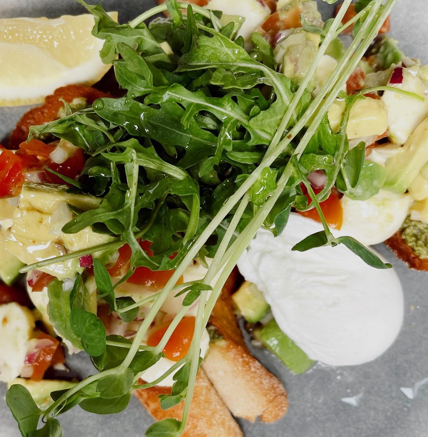 A Close Up of a Plate of Food With Vegetables and Eggs — The Pass Cafe in Byron Bay, NSW