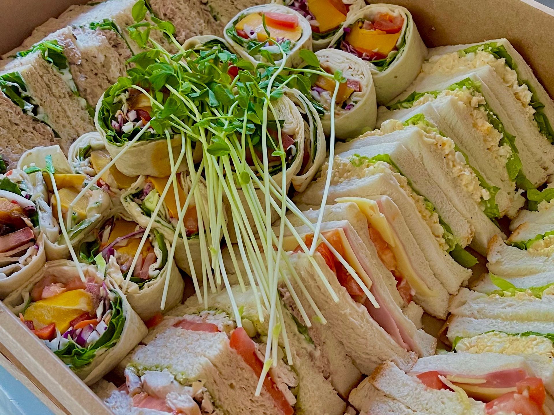 A close up of a tray of sandwiches and wraps — The Pass Cafe in Byron Bay, NSW