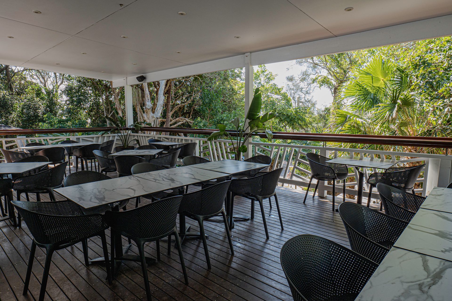 A Person is Holding a Sandwich With Shrimp, Lettuce, and a Slice of Lemon — The Pass Cafe in Byron Bay, NSW