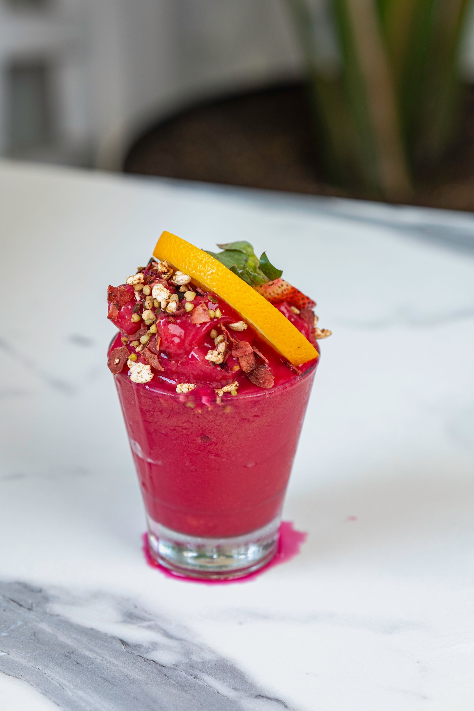 A Close Up of a Red Smoothie in a Glass on a Table — The Pass Cafe In Byron Bay, NSW