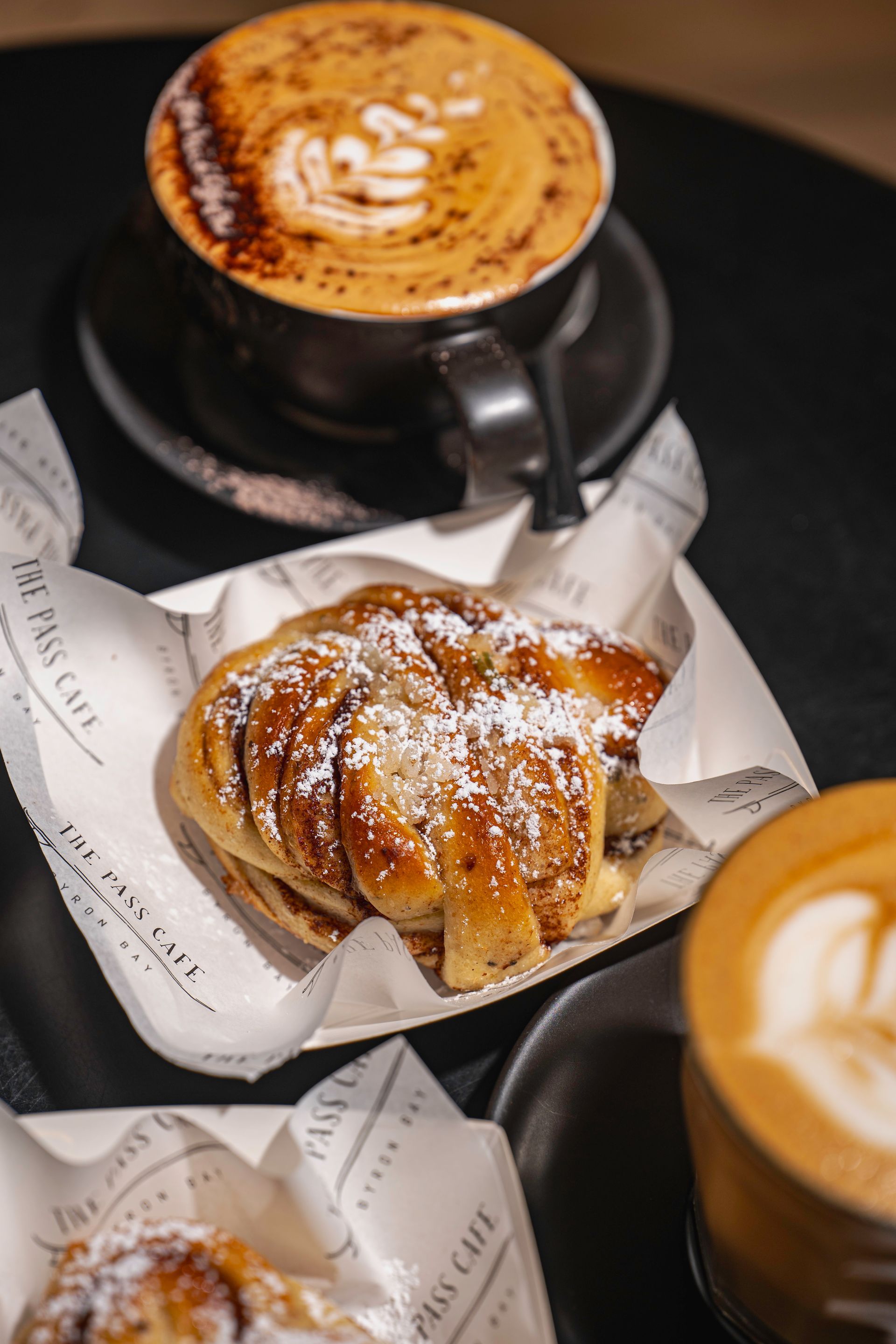 A Close Up of a Plate of Food and a Cup of Coffee on a Table — The Pass Cafe In Byron Bay, NSW