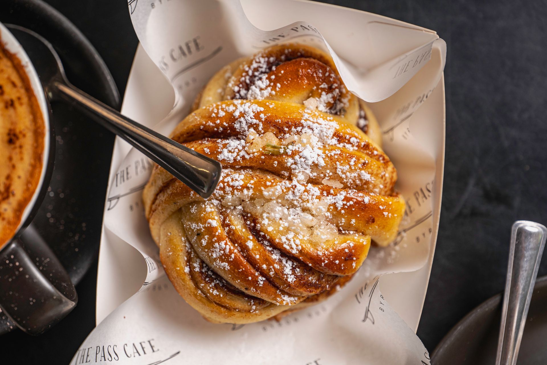 A Close Up of a Pastry With Powdered Sugar on It — The Pass Cafe In Byron Bay, NSW