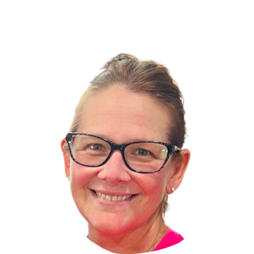 A woman wearing glasses and a pink shirt is smiling.