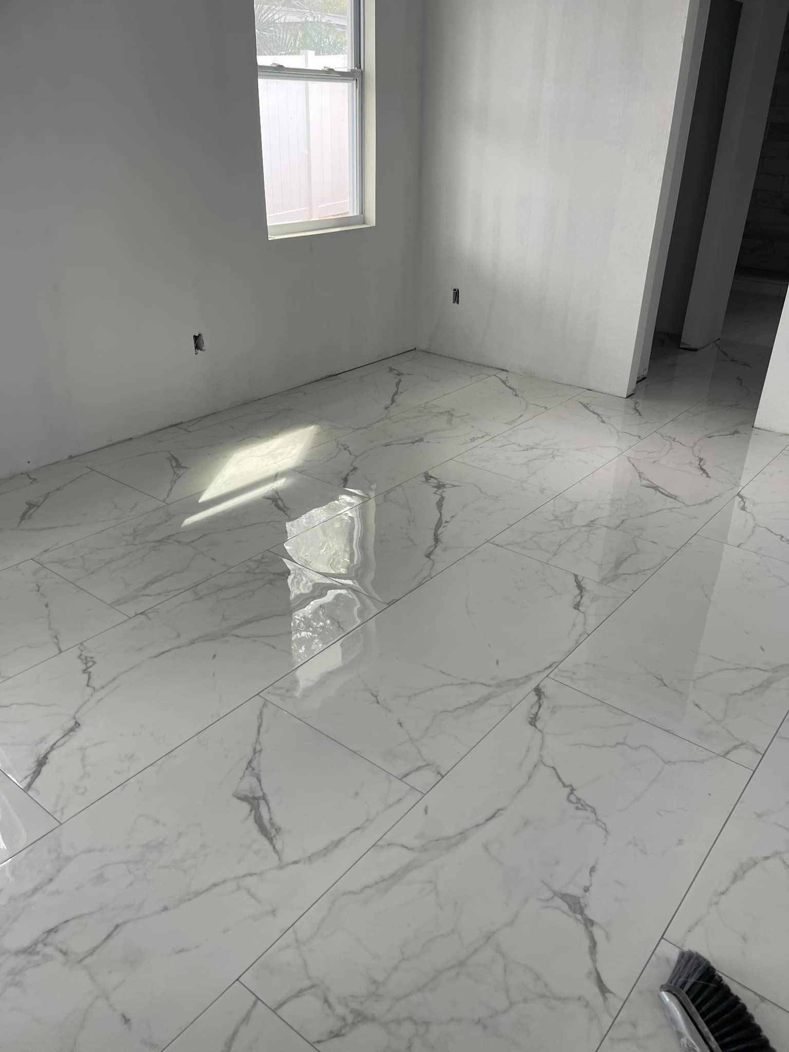 Room with White Tiles - Tampa, FL - Amnier Flooring