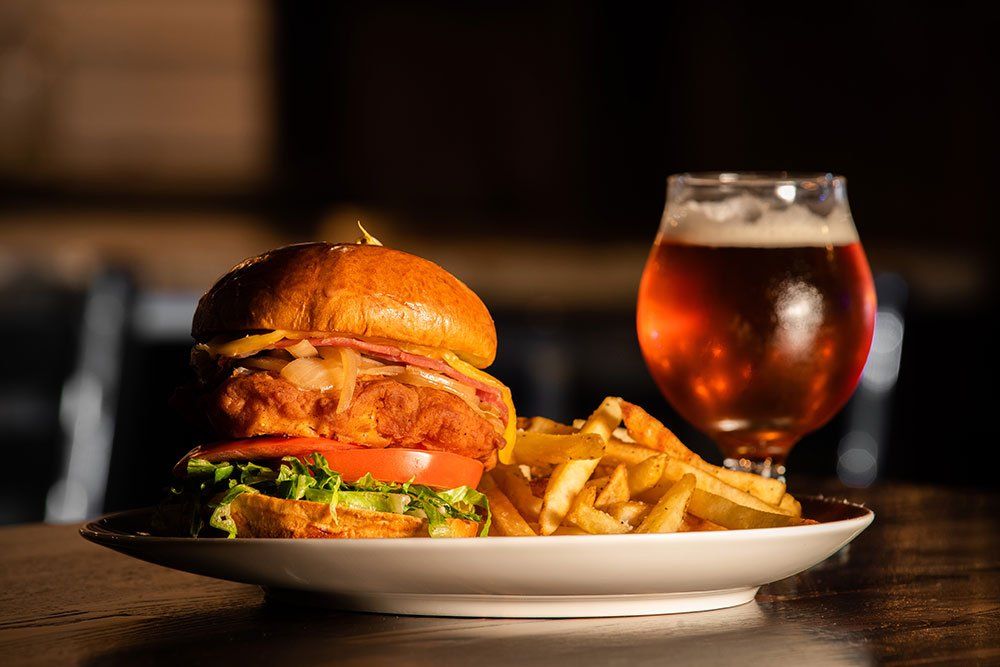 Buttermilk Chicken Sandwich with fries and beer