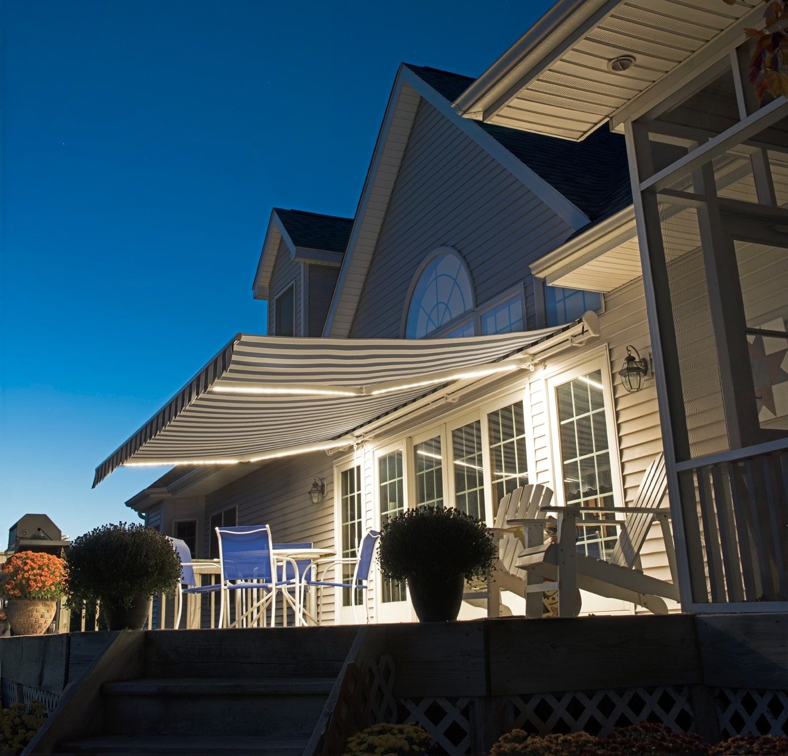 A large house with a large awning over the porch