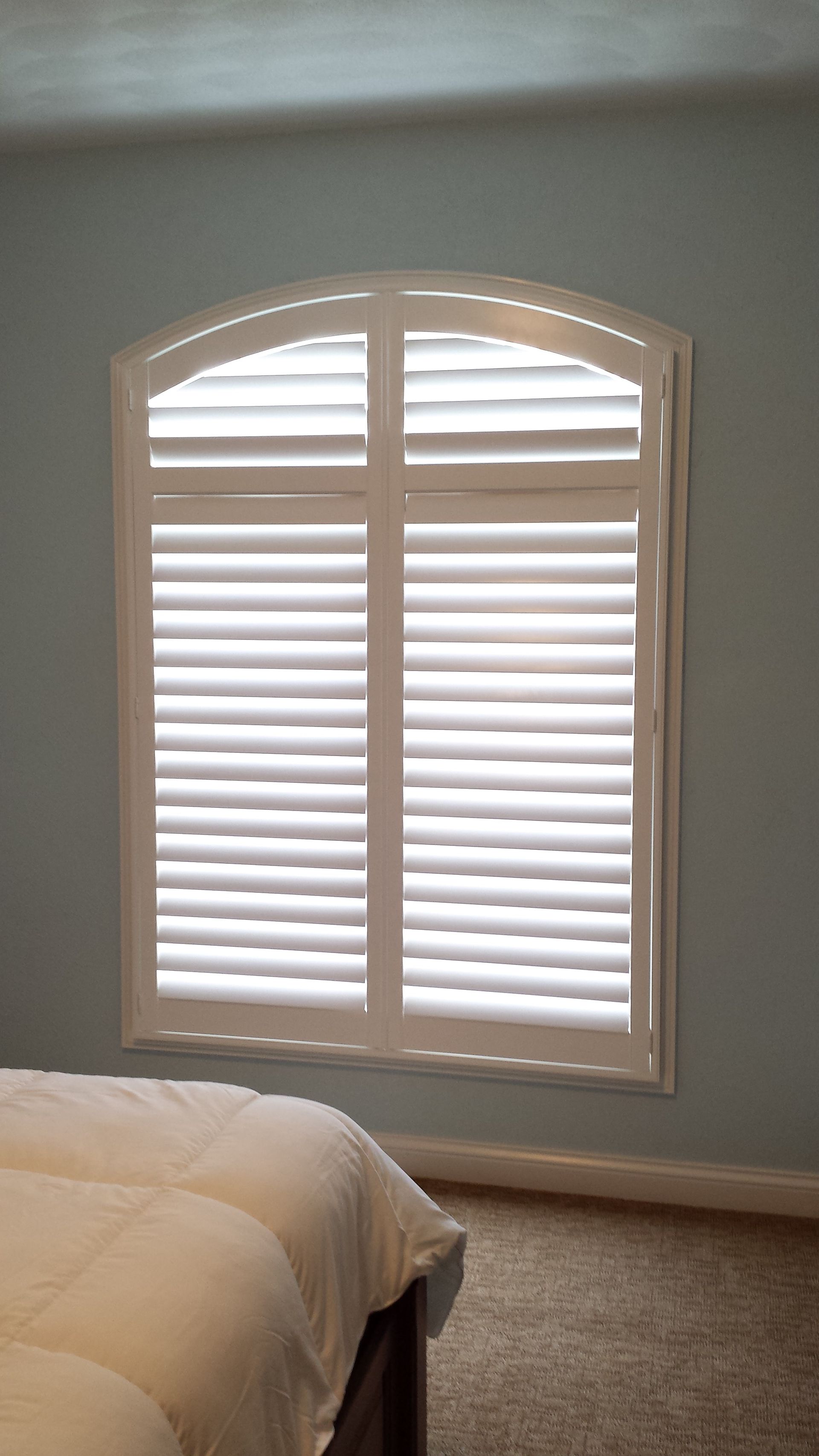 Solar Shield Roller Shade and Panel Track installed in a kitchen