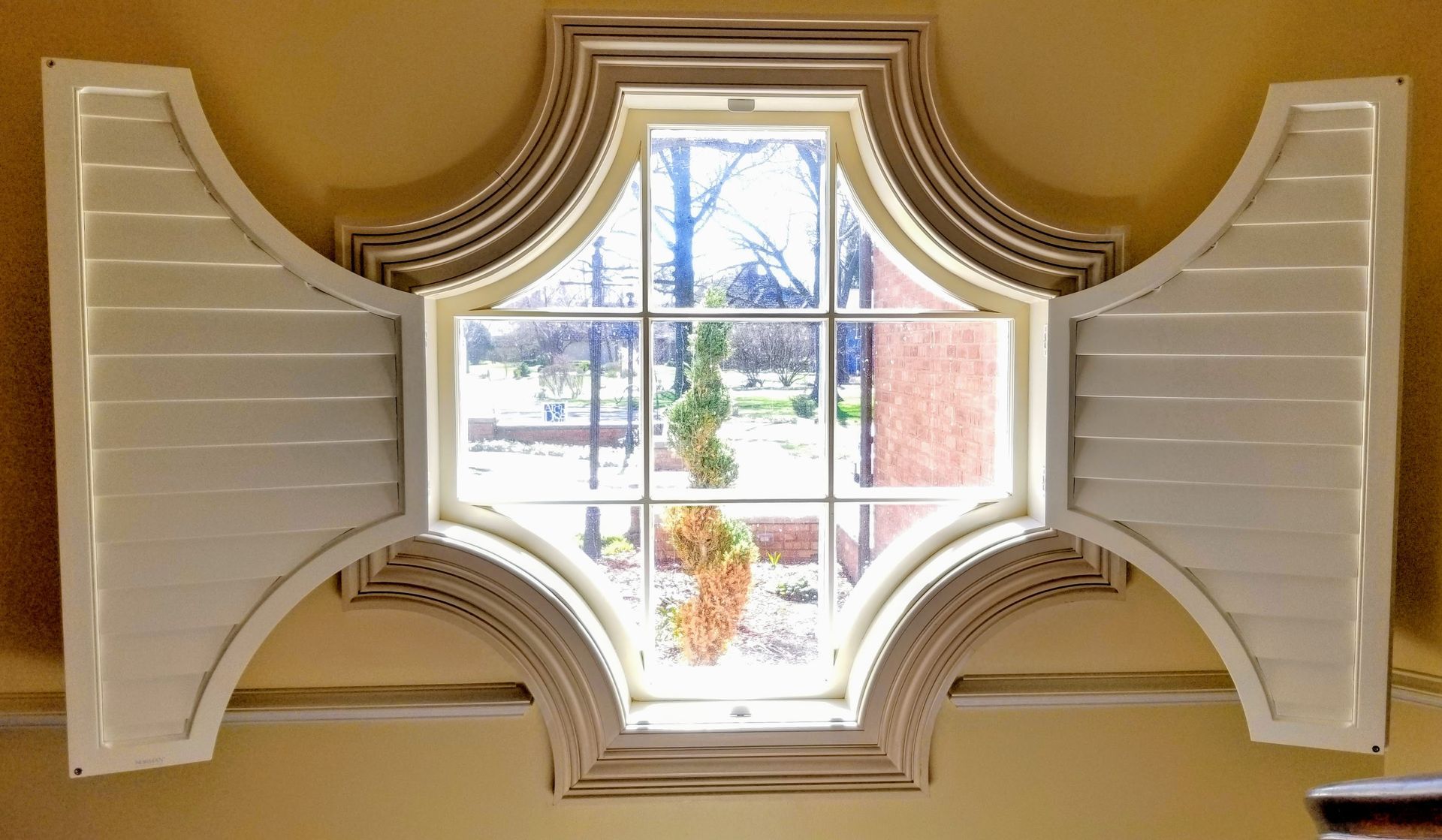 Solar Shield Shutter installed on specialty shaped window