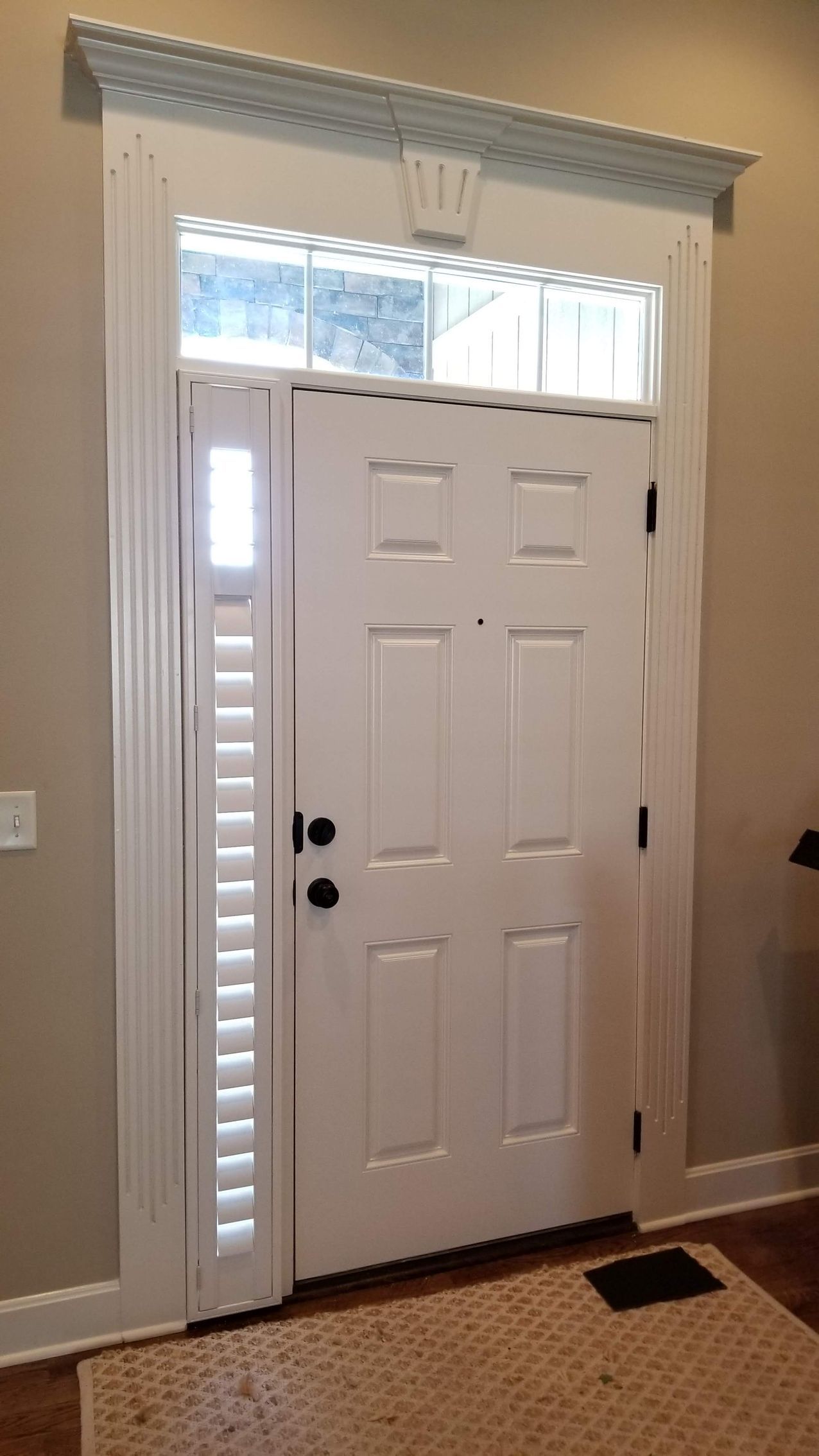 Solar Shield Roller Shade and Panel Track installed in a kitchen