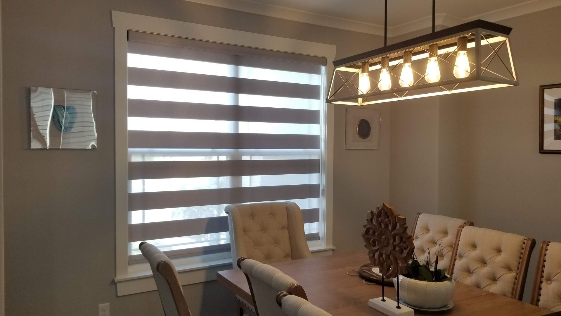 Dining room with a Solar Shield Banded Shade in the privacy position