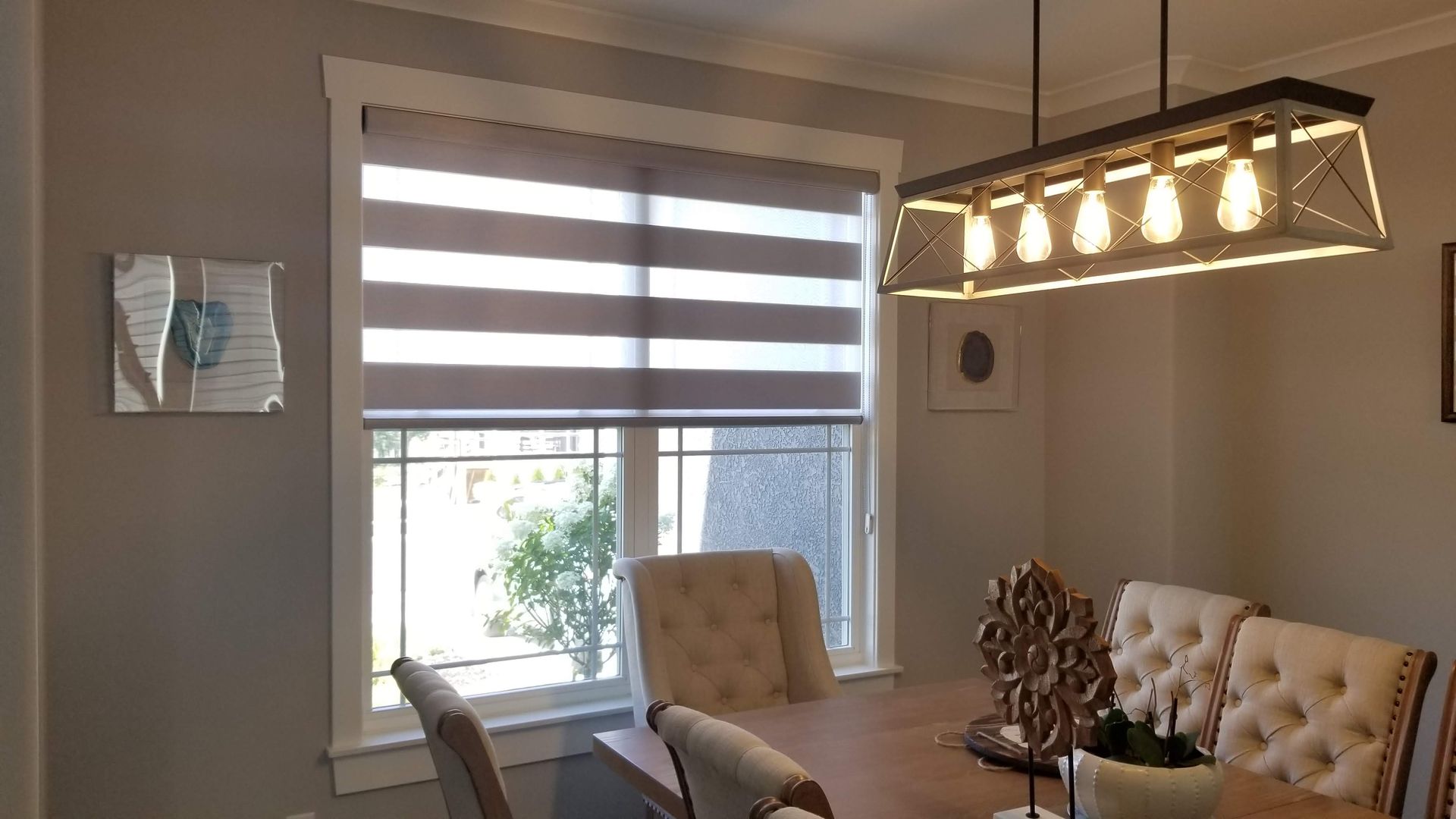 Dining room with partially opened Solar Shield Banded Shade