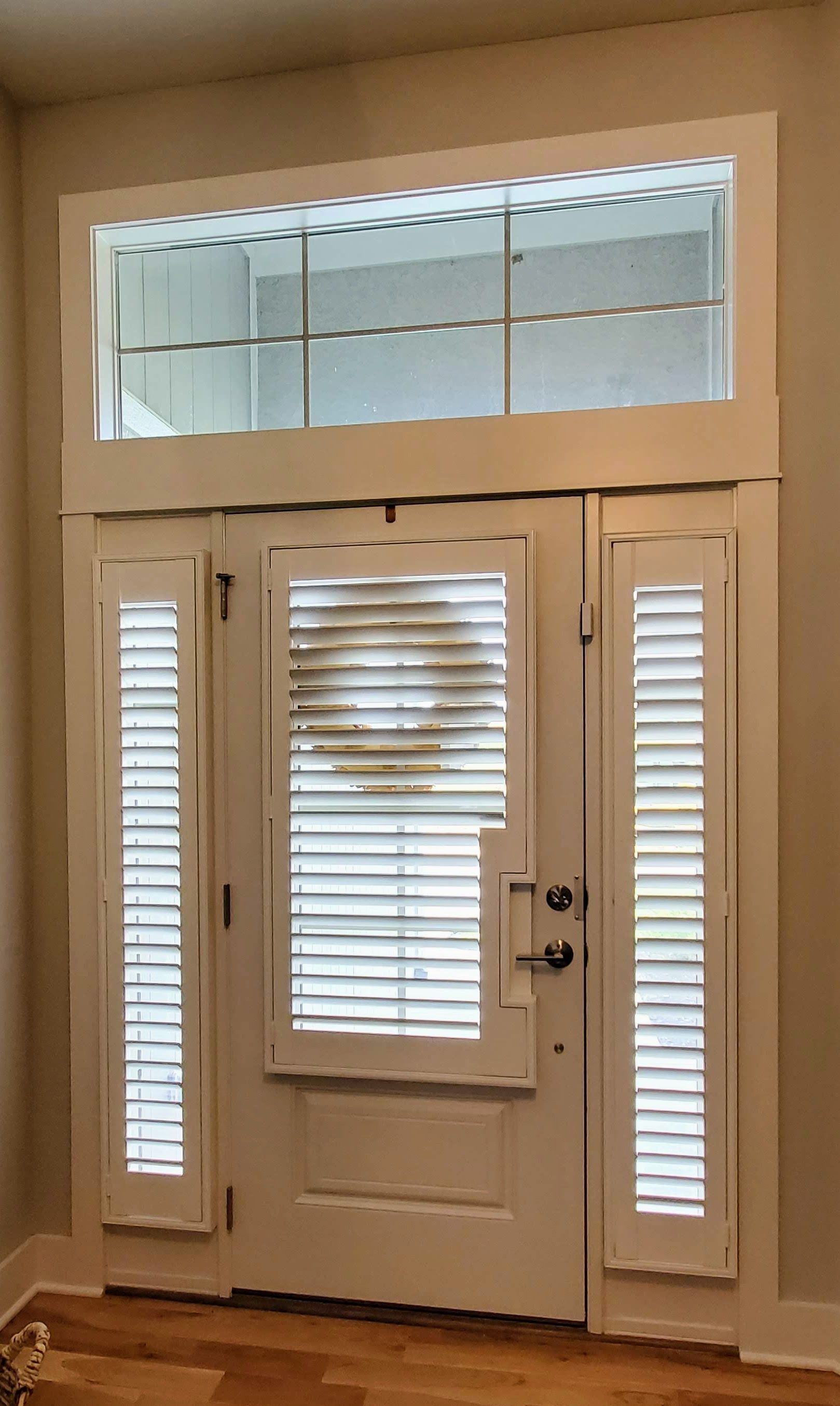 Solar Shield Roller Shades with side panel draperies and custom drapery hardware