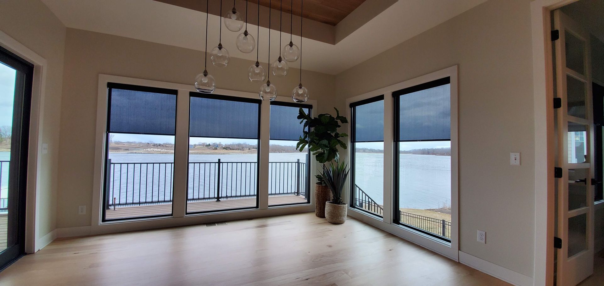Solar Shield Roller Shade installed in windows looking over Lake Winnebago near Lee's Summit, MO 