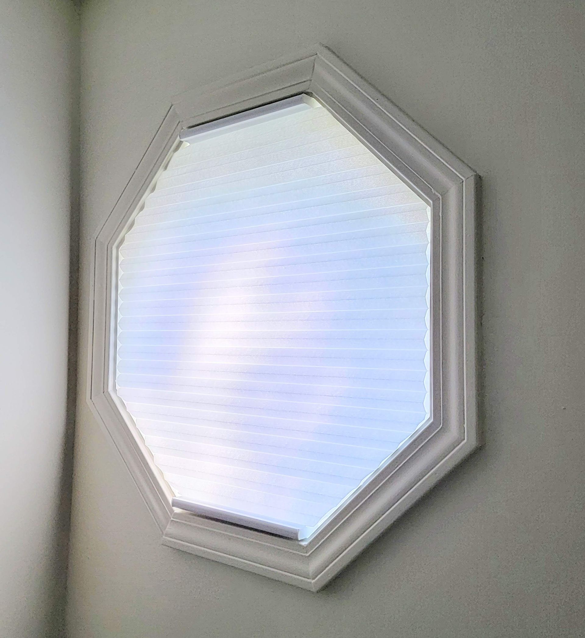 Solar Shield Honeycomb Shades installed on octagon window