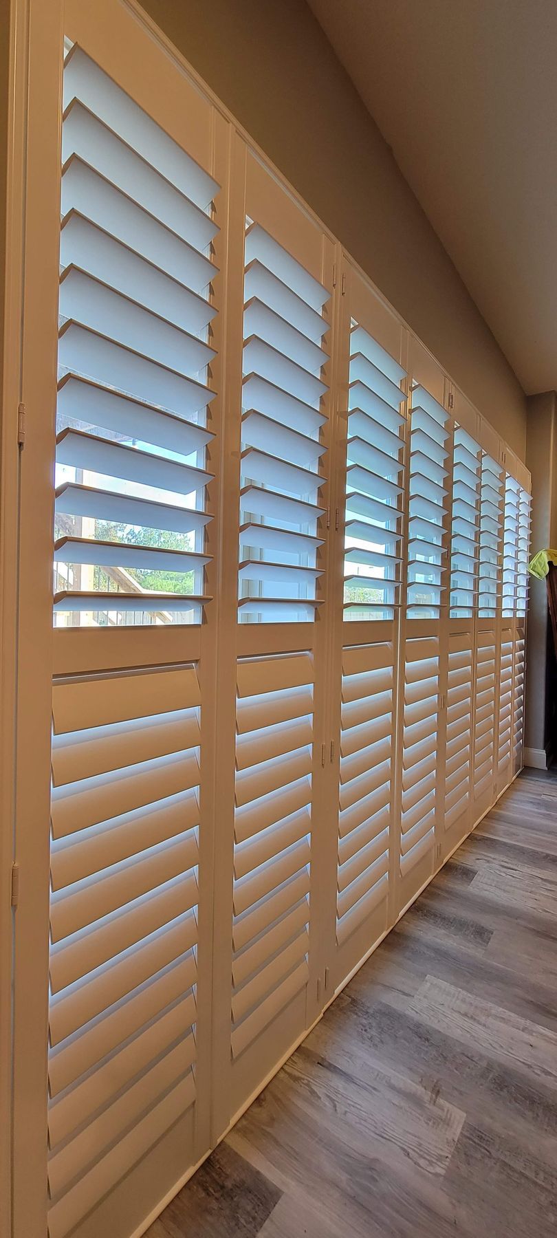 Solar Shield Plantation Shutters installed over a patio door