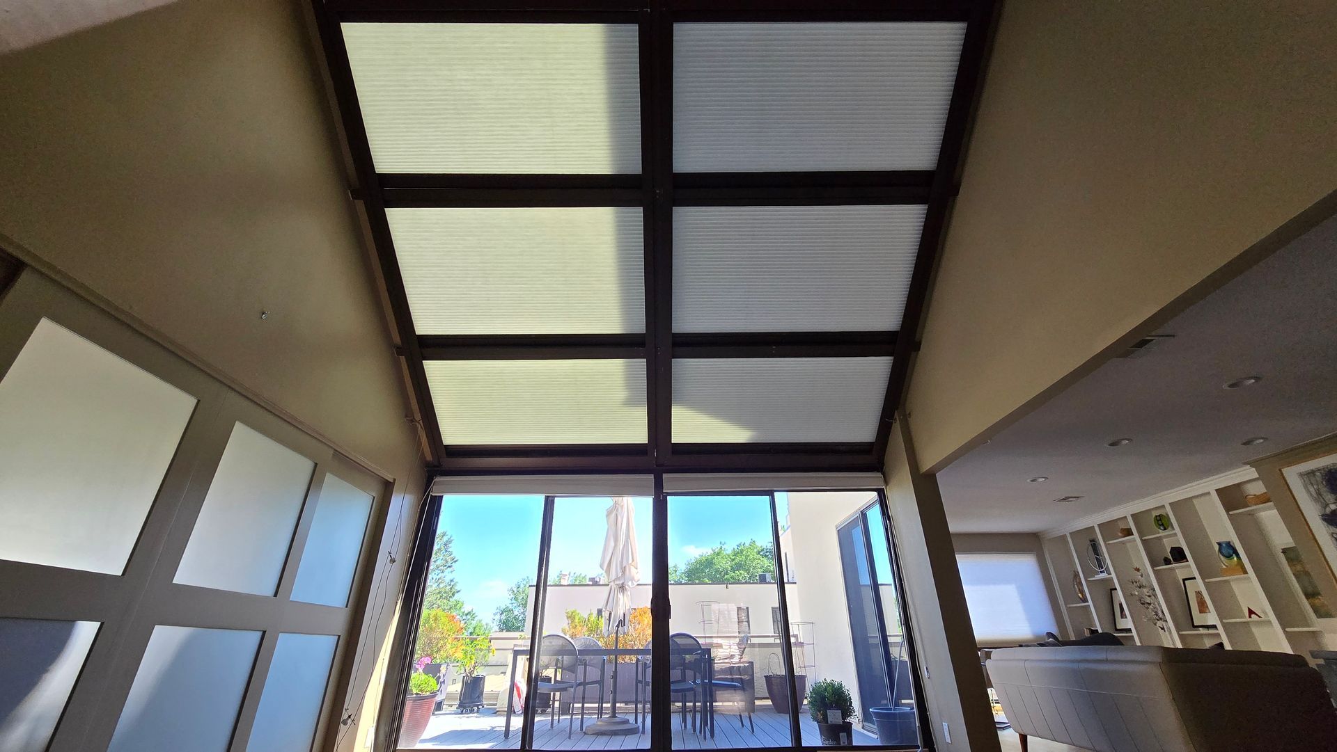 Solar Shield Roller Shade and Panel Track installed in a kitchen