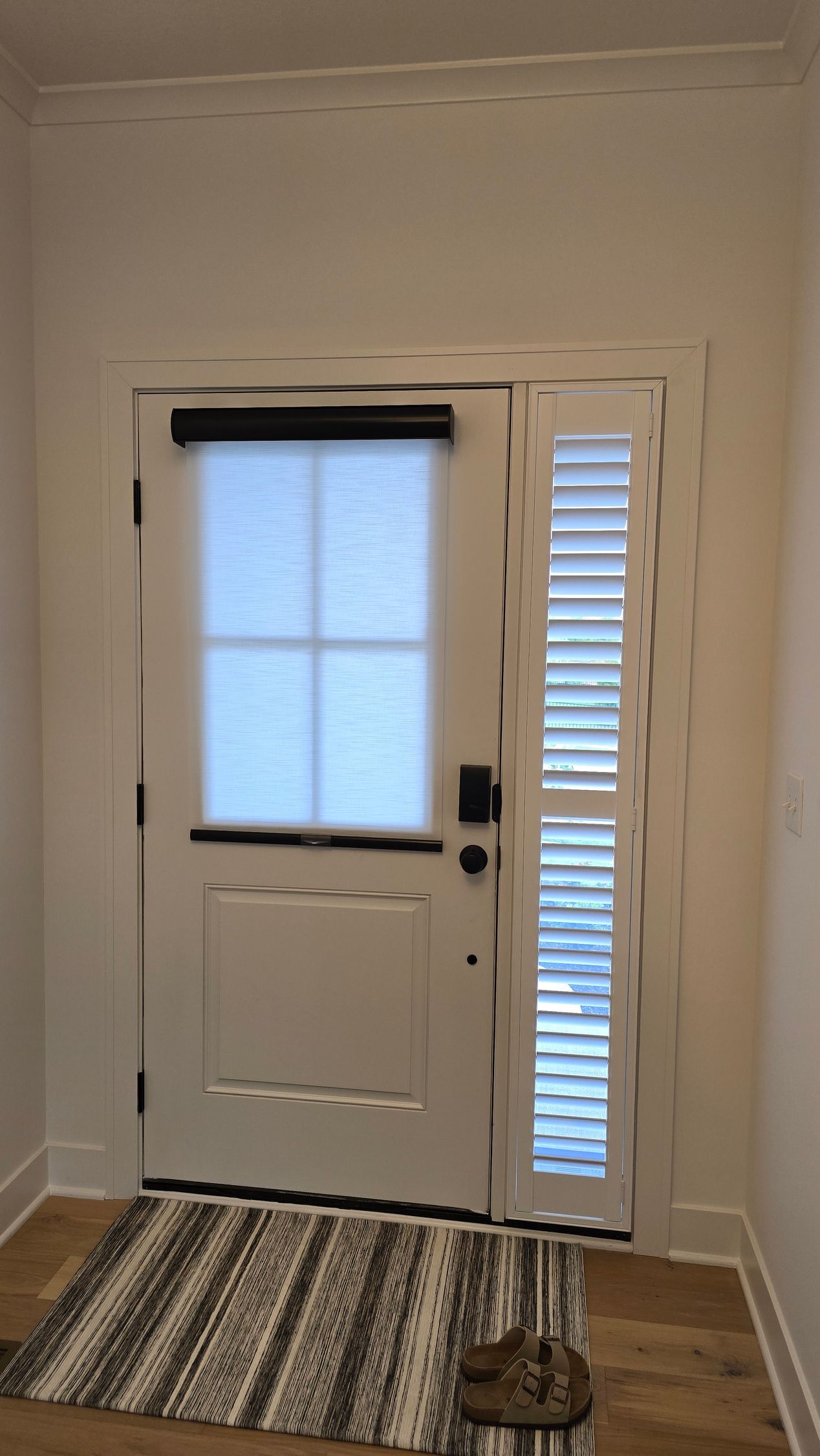 Solar Shield Roller Shade installed on angle toped windows in a great room