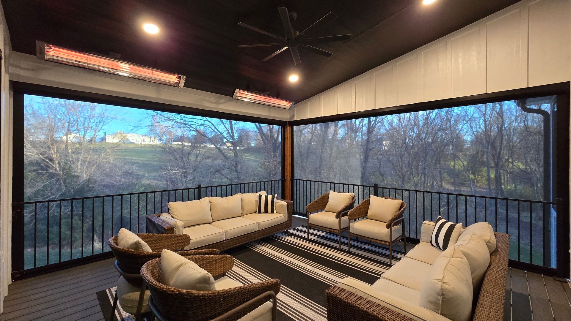 Solar Shield patio shades holding heat in a patio space in winter with ceiling heaters warming the space