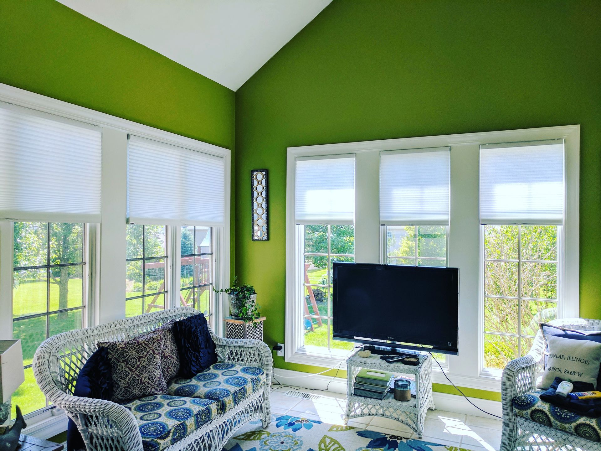 Solar Shield Honeycomb Shades installed in green sun room
