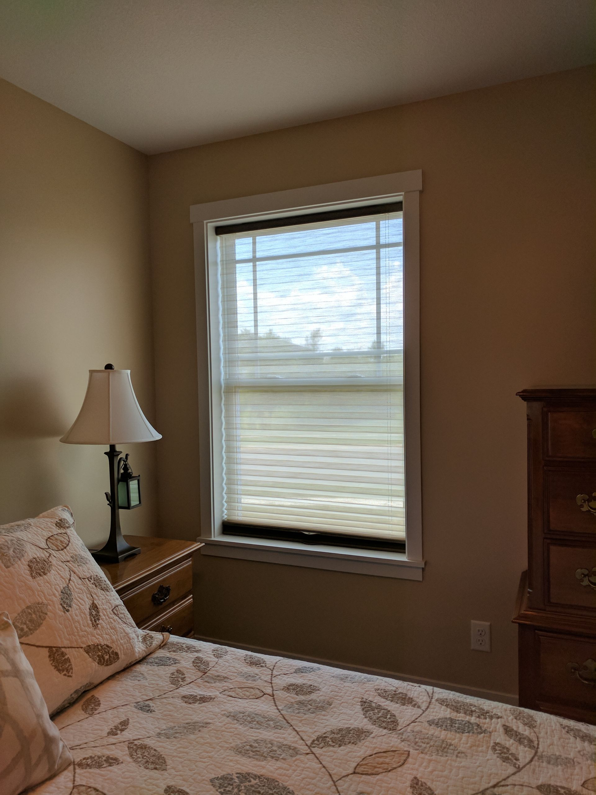 Solar Shield Honeycomb Shades with pleated sheer fabric in primary bedroom