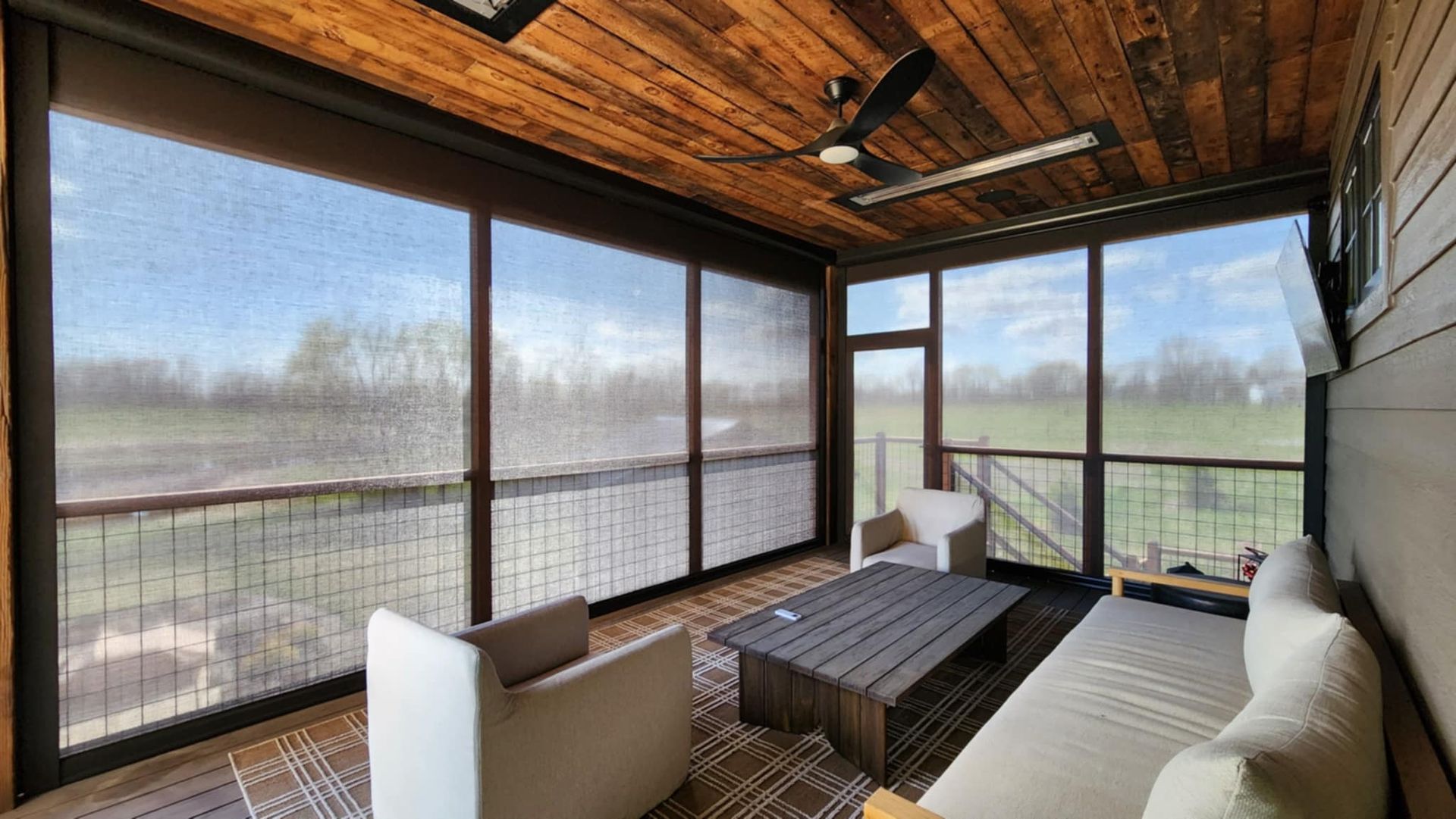 Screened in porch with Solar Shield patio shades installed over bug screens.