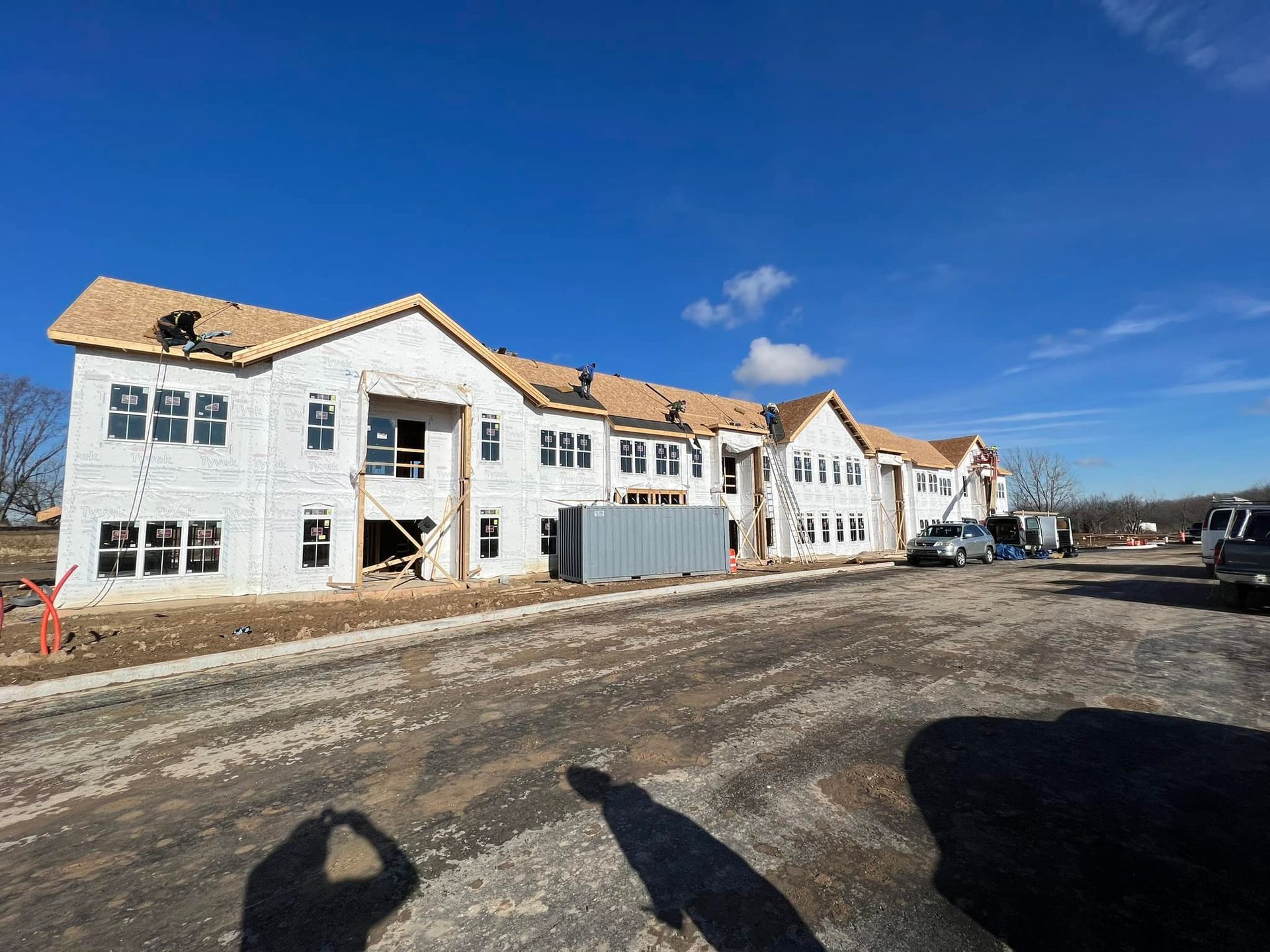 A large house with a large lawn in front of it.