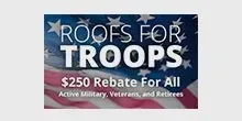 A sign that says `` roofs for troops '' with an american flag in the background.
