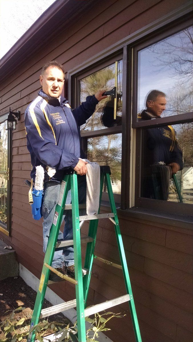 Owner On Ladder — Hadley, MA — Family Window Cleaning & Property Maintenance